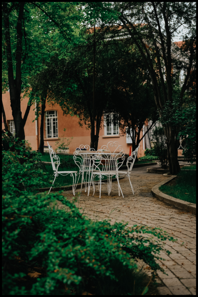 A patio table and chairs on a garden patio