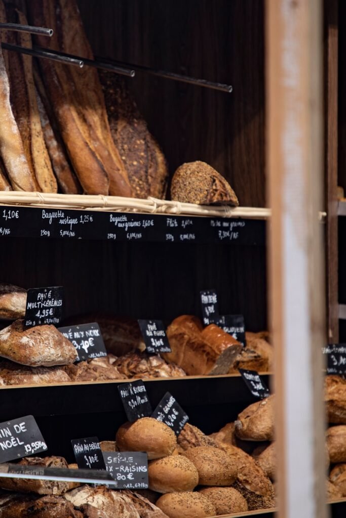 A French boulangerie case with filled with various bread and baguette loaves