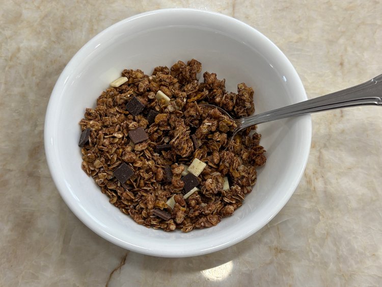 A bowl of chocolate granola cereal