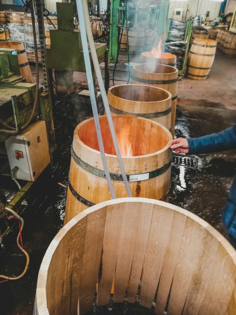 Toasting French wine barrels